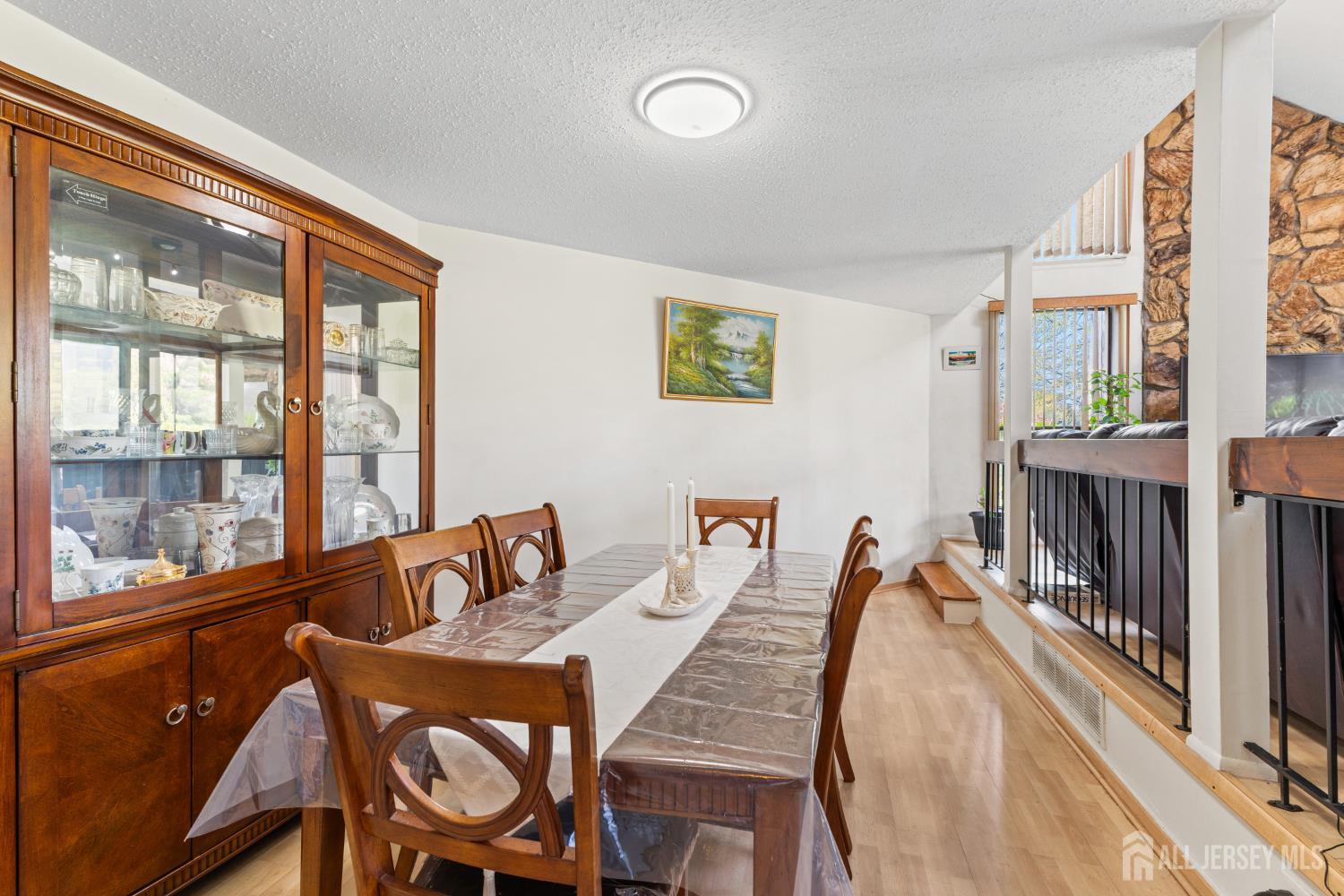 51 Westgate Drive Edison, NJ 08820 - Photo 15 of 48 a dining room with furniture and a floor to ceiling window