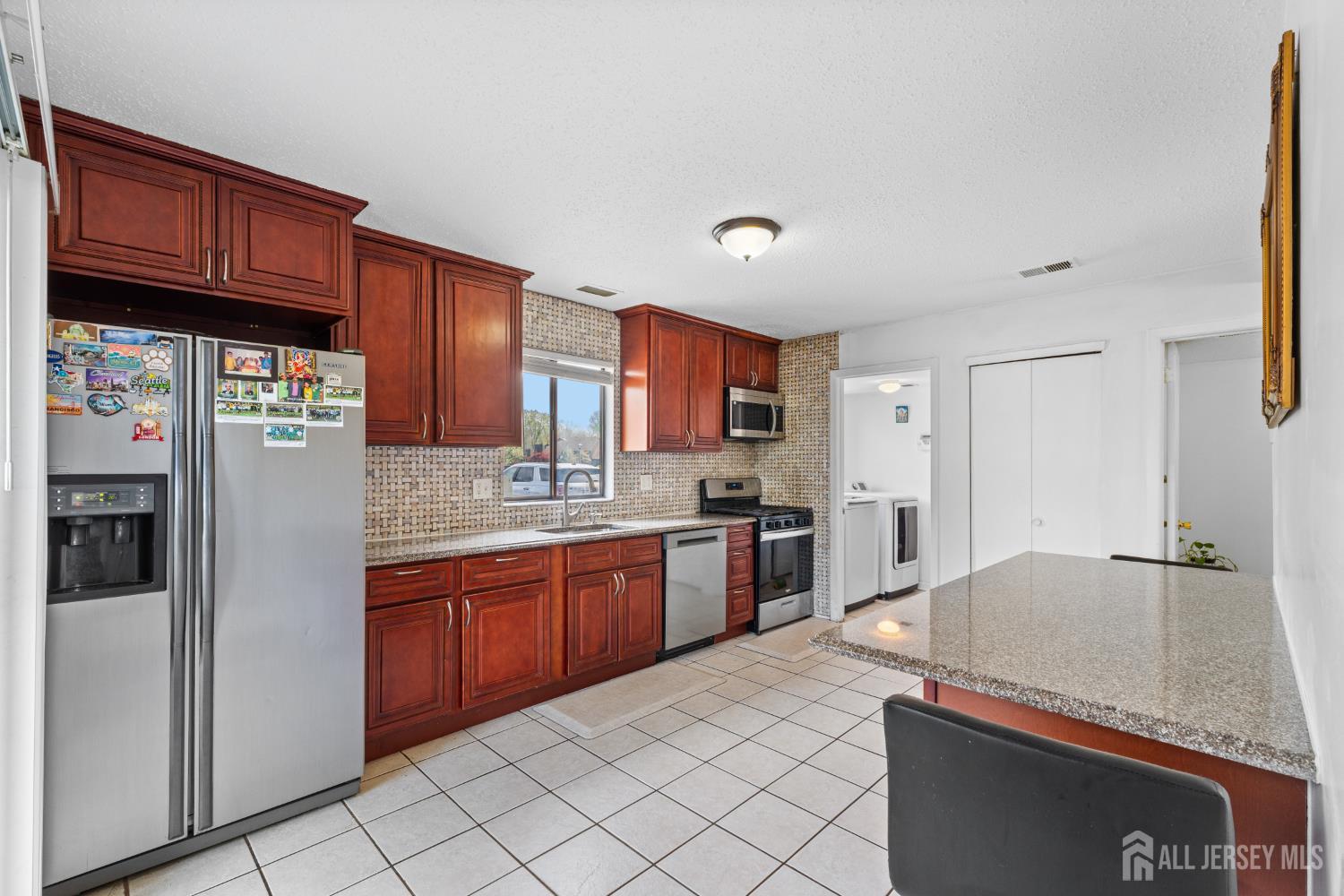 51 Westgate Drive Edison, NJ 08820 - Photo 16 of 48 a kitchen with stainless steel appliances granite countertop a refrigerator and a sink