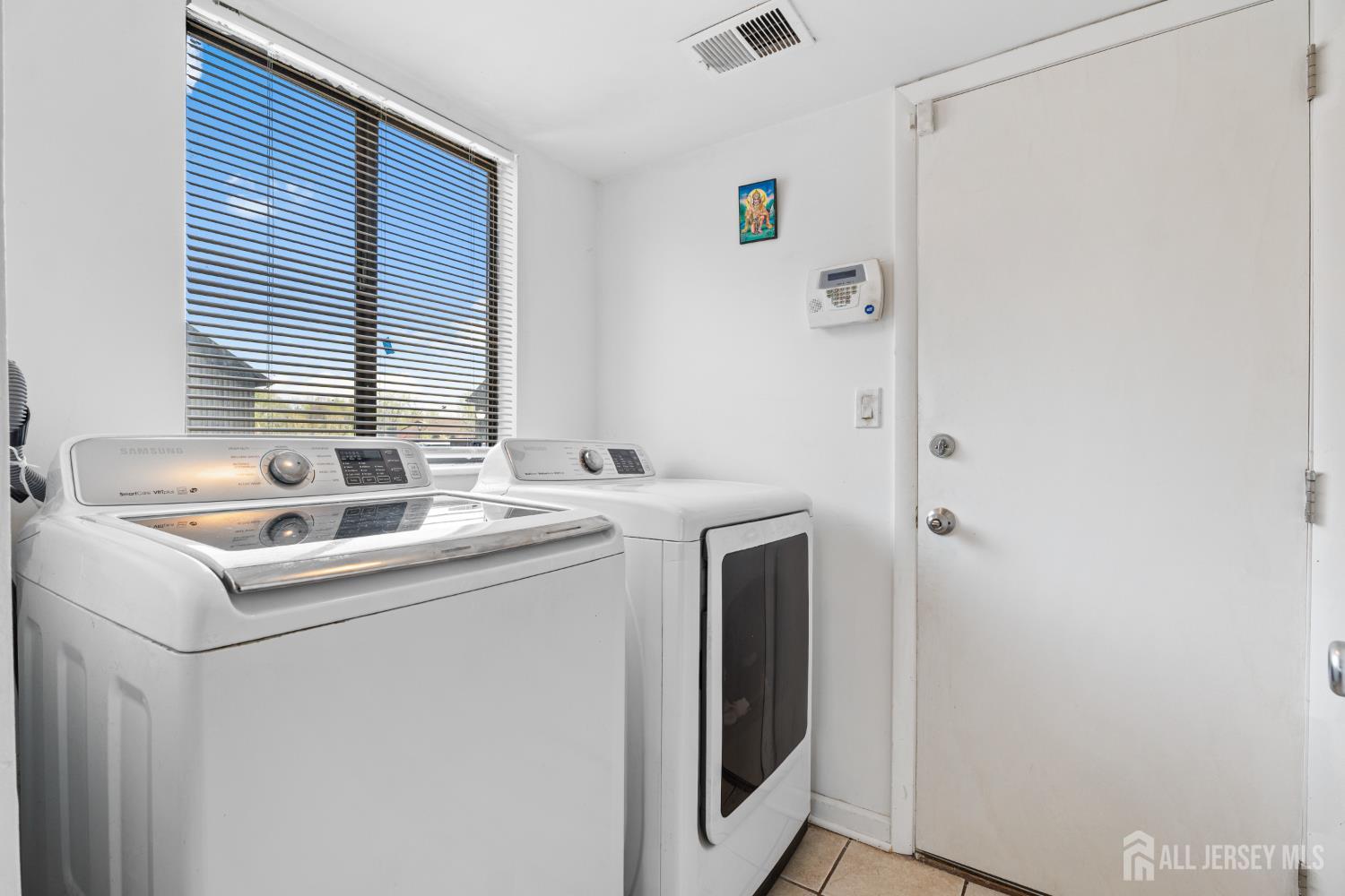 51 Westgate Drive Edison, NJ 08820 - Photo 22 of 48 a utility room with dryer and washer