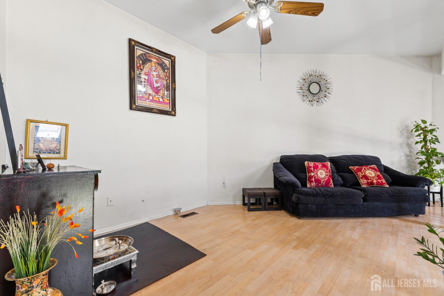 51 Westgate Drive Edison, NJ 08820 - Photo 28 of 48 a living room with furniture and a flat screen tv