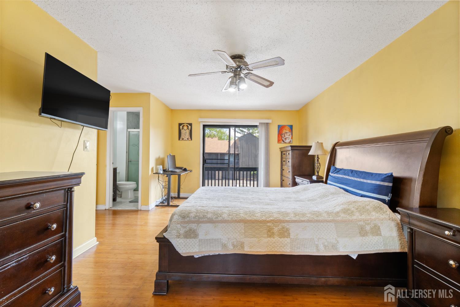 51 Westgate Drive Edison, NJ 08820 - Photo 30 of 48 a bedroom with a bed and a flat screen tv