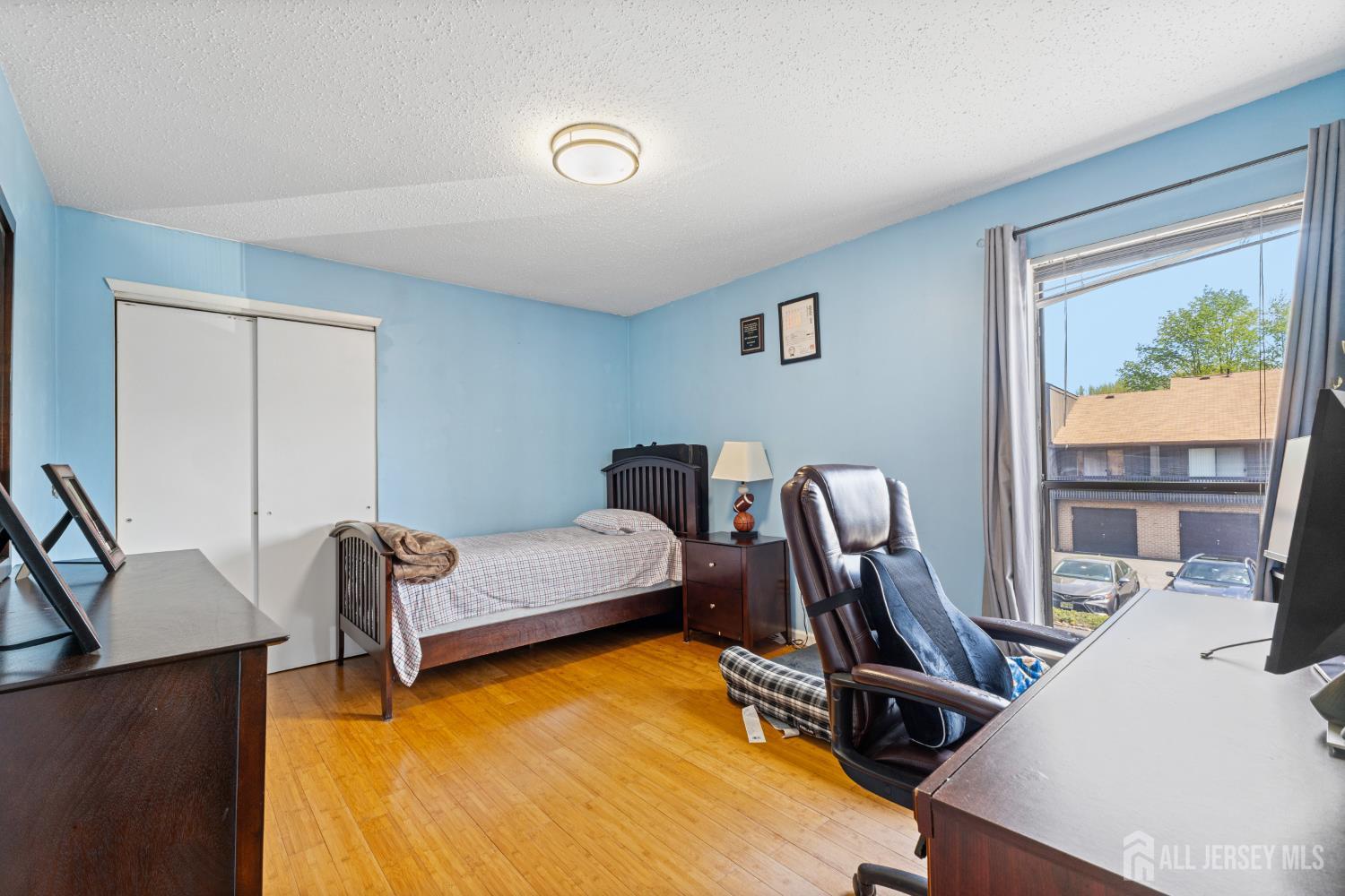 51 Westgate Drive Edison, NJ 08820 - Photo 31 of 48 a bedroom with furniture and a window