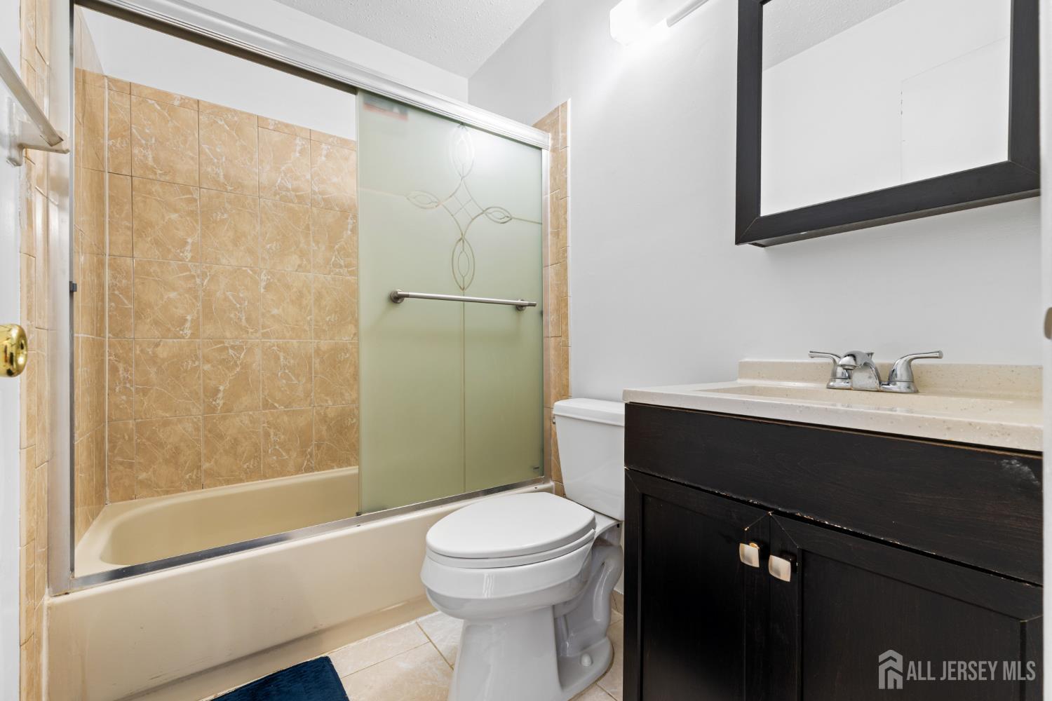 51 Westgate Drive Edison, NJ 08820 - Photo 33 of 48 a bathroom with a sink a toilet and shower