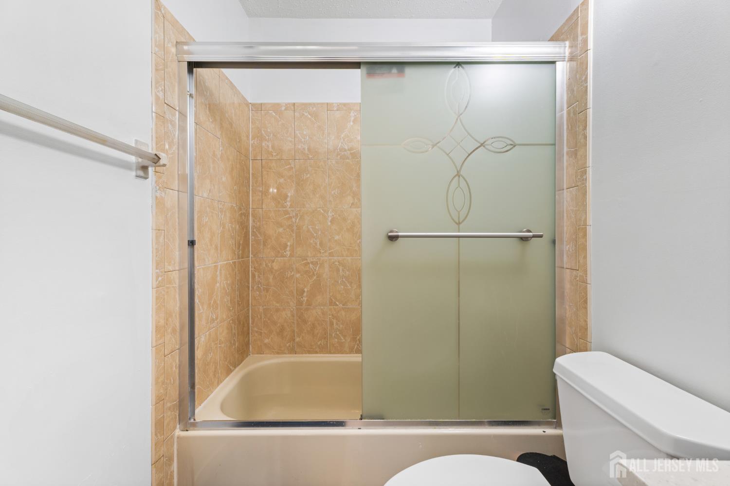 51 Westgate Drive Edison, NJ 08820 - Photo 34 of 48 a bathroom with a shower and a toilet