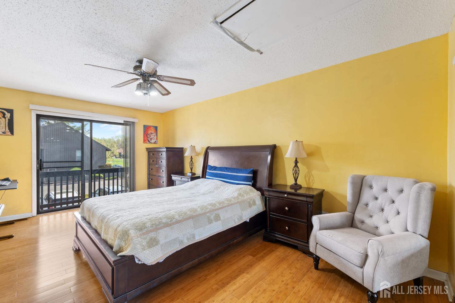 51 Westgate Drive Edison, NJ 08820 - Photo 36 of 48 a bedroom with a bed and wooden floor