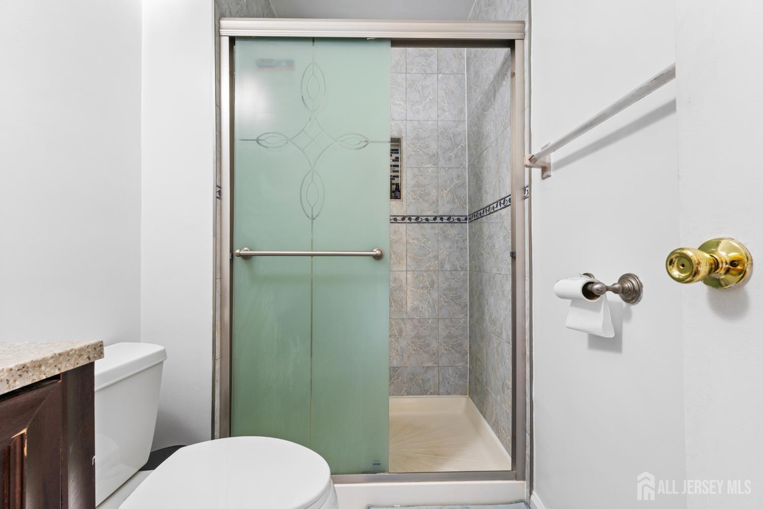 51 Westgate Drive Edison, NJ 08820 - Photo 39 of 48 a bathroom with a toilet and a shower