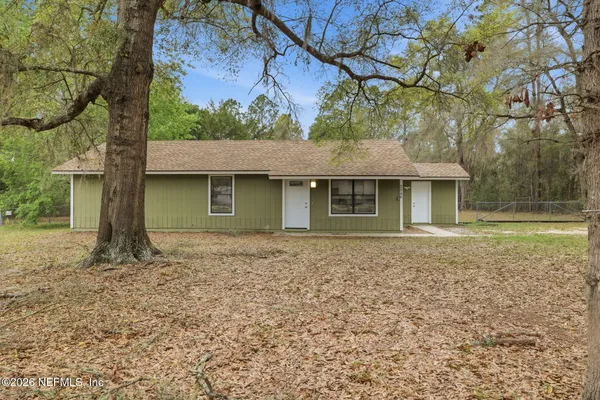 front view of a house with a yard