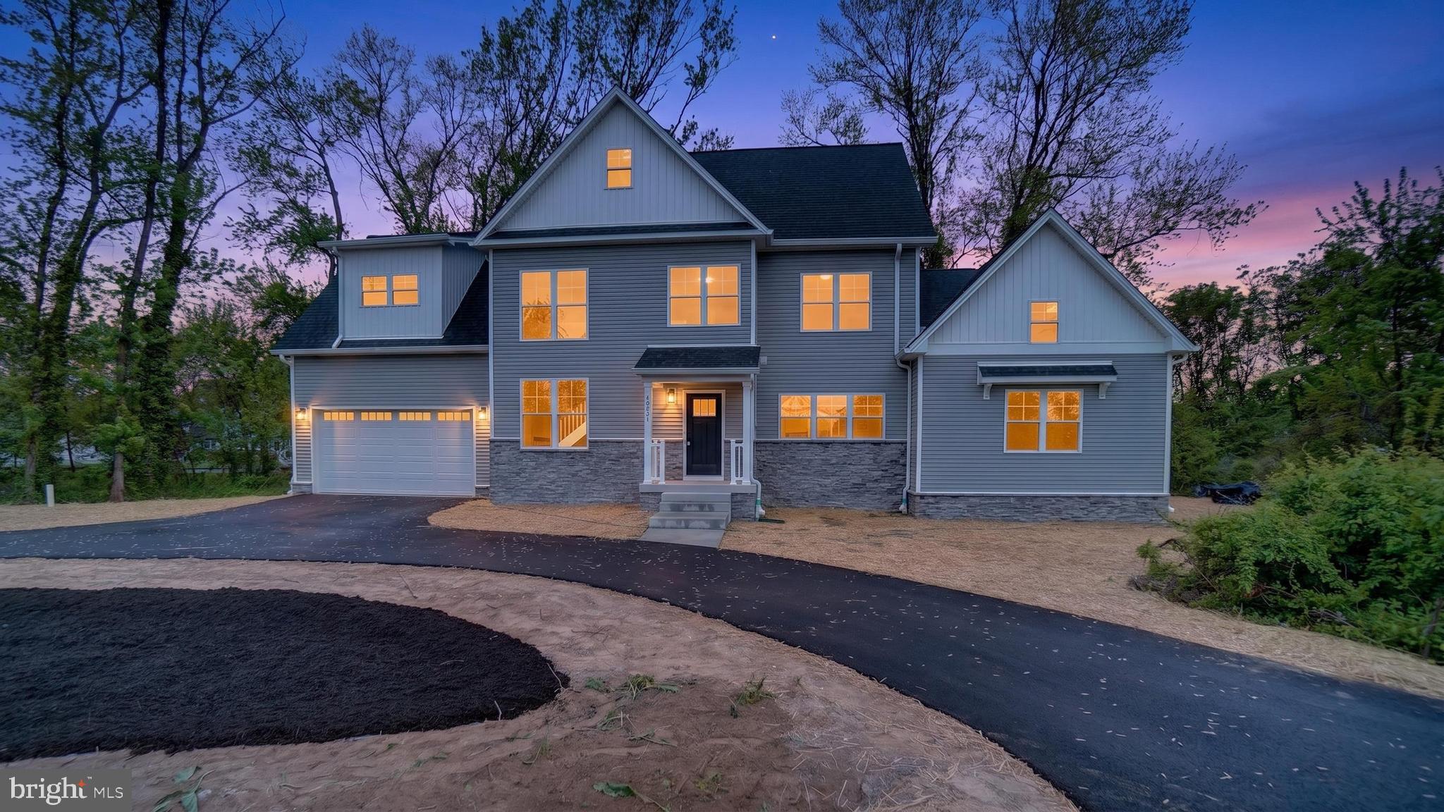 2001 Poplar Ridge Road Pasadena, MD 21122 - Photo 66 of 83 a front view of a house with garden