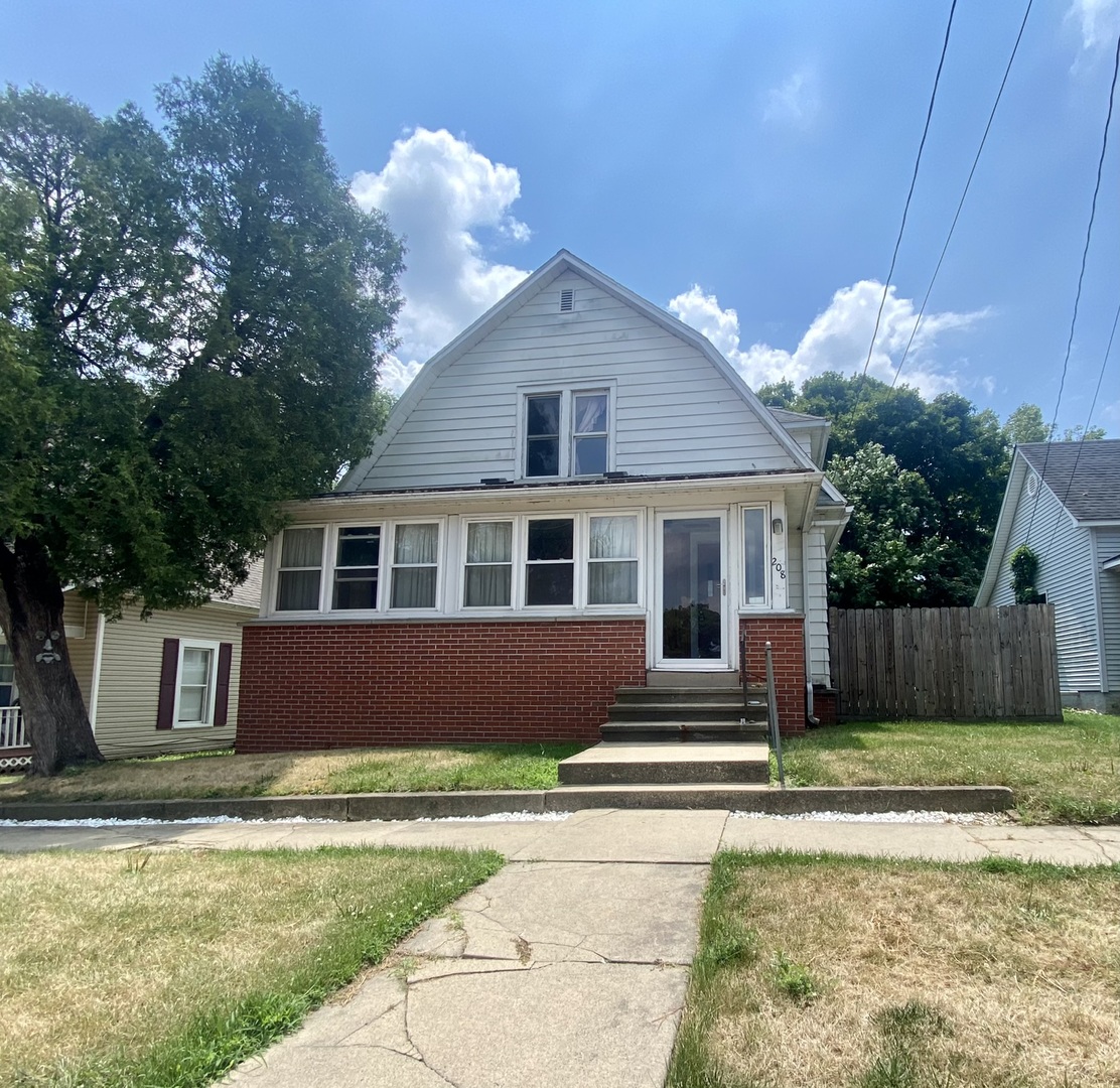 208 East State Street Fairmount, IL 61841 - Photo 1 of 42 a front view of a house with a yard and garage