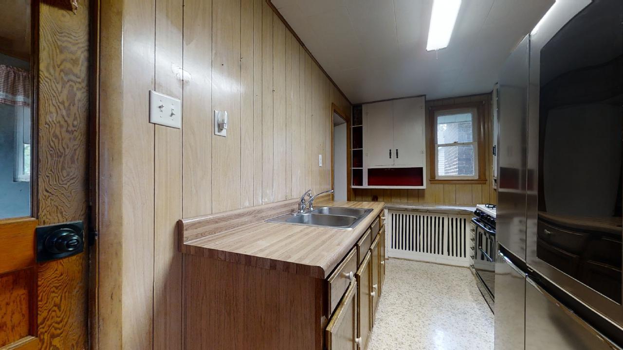 208 East State Street Fairmount, IL 61841 - Photo 15 of 42 a bathroom with a sink a large mirror and a bathtub