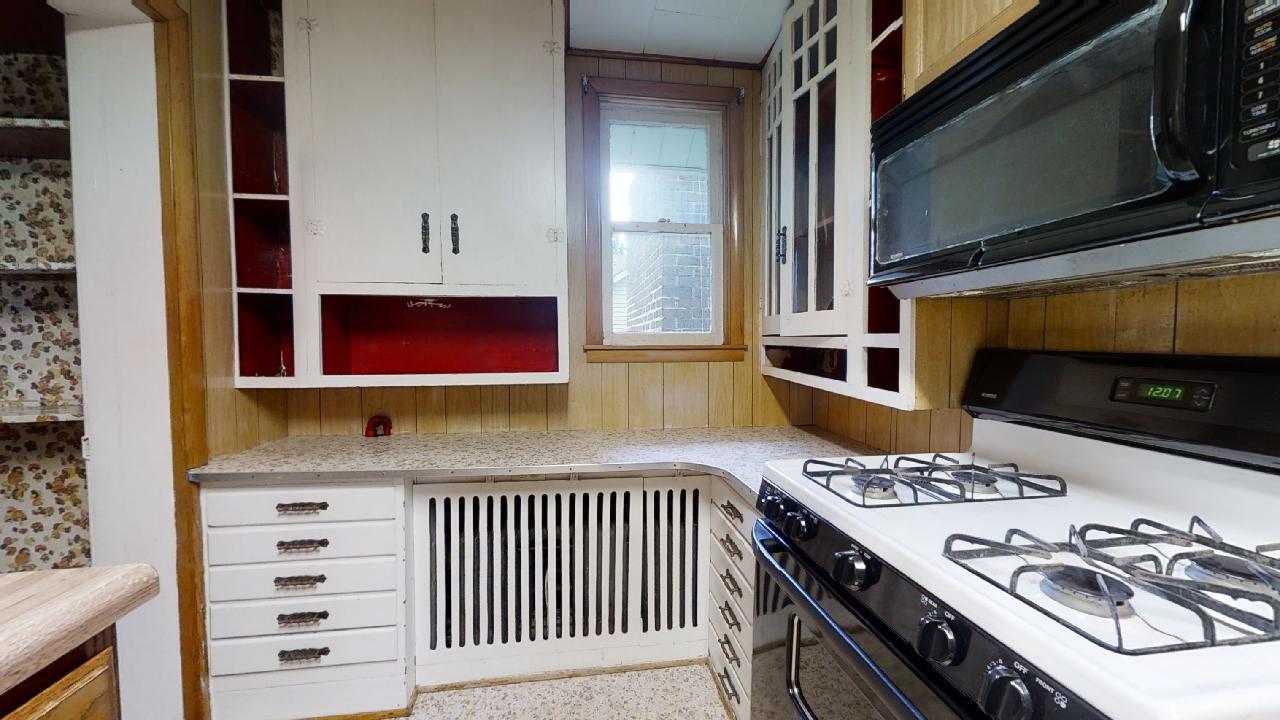 208 East State Street Fairmount, IL 61841 - Photo 16 of 42 a kitchen with stainless steel appliances a stove and a microwave