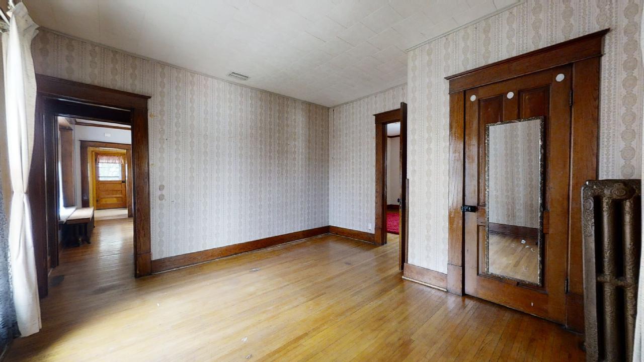 208 East State Street Fairmount, IL 61841 - Photo 21 of 42 a view of a hallway with wooden floor and closet