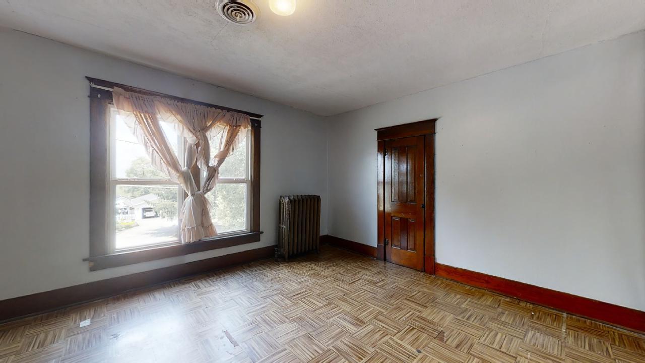 208 East State Street Fairmount, IL 61841 - Photo 23 of 42 an empty room with windows and closet