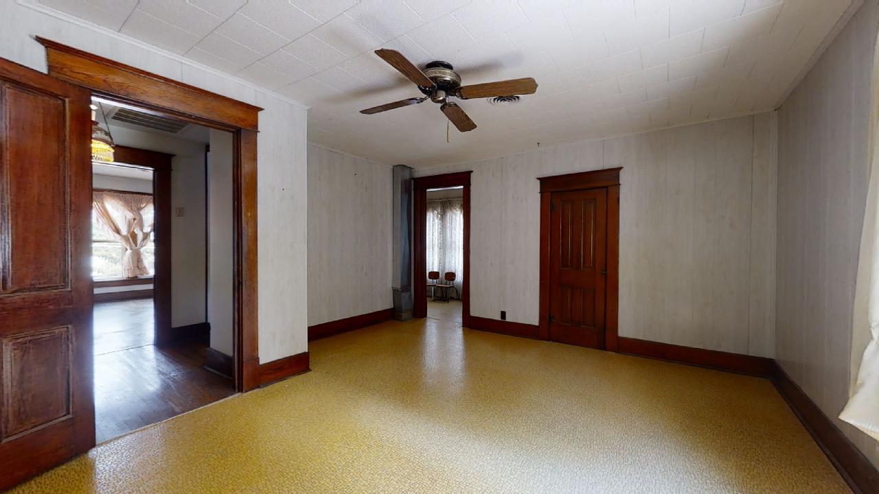 208 East State Street Fairmount, IL 61841 - Photo 28 of 42 a view of a livingroom with wooden floor and a ceiling fan