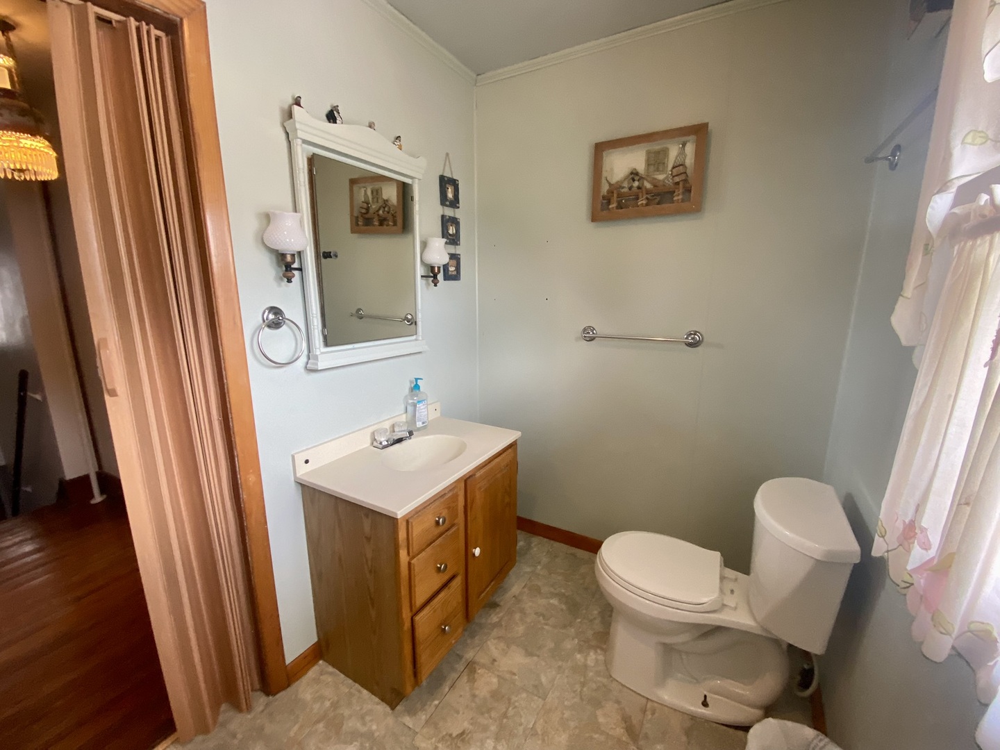 208 East State Street Fairmount, IL 61841 - Photo 33 of 42 a bathroom with a toilet a sink and a mirror