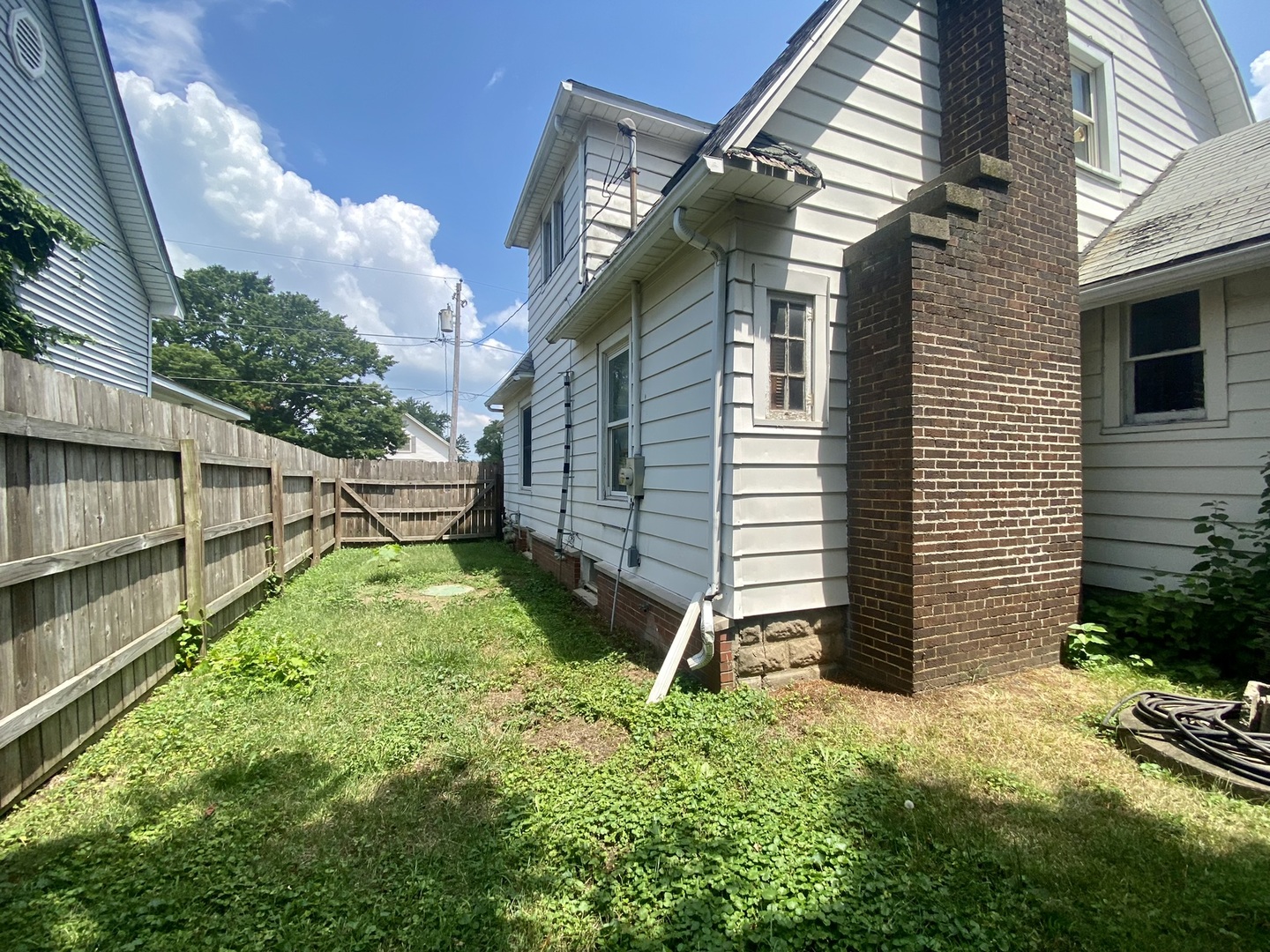208 East State Street Fairmount, IL 61841 - Photo 39 of 42 a view of backyard with garden and deck