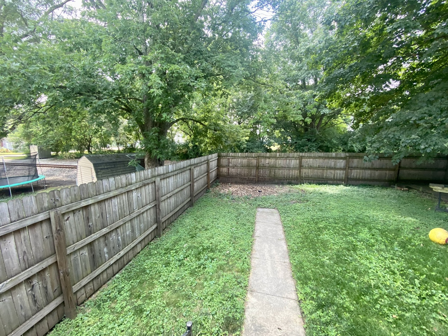 208 East State Street Fairmount, IL 61841 - Photo 40 of 42 a view of a backyard with wooden fence