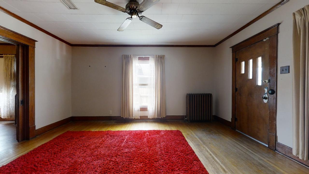 208 East State Street Fairmount, IL 61841 - Photo 6 of 42 a view of room with window and hardwood floor