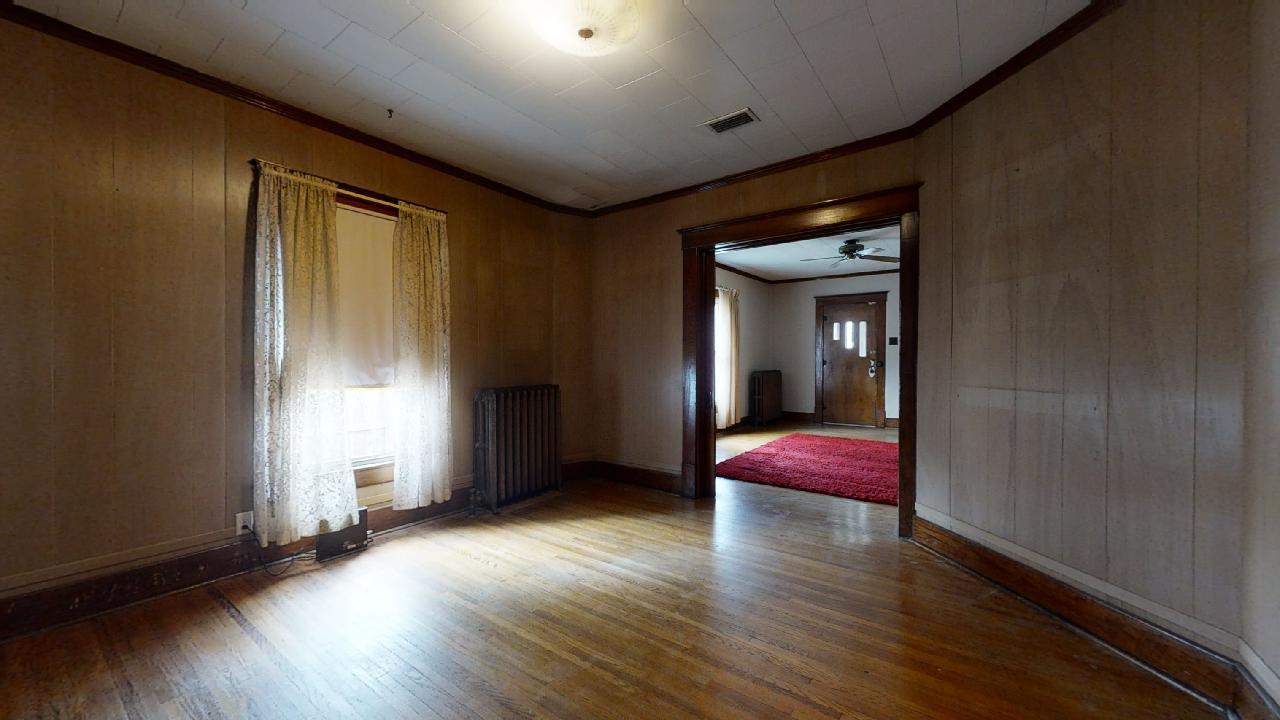 208 East State Street Fairmount, IL 61841 - Photo 9 of 42 wooden floor in an empty room with a window