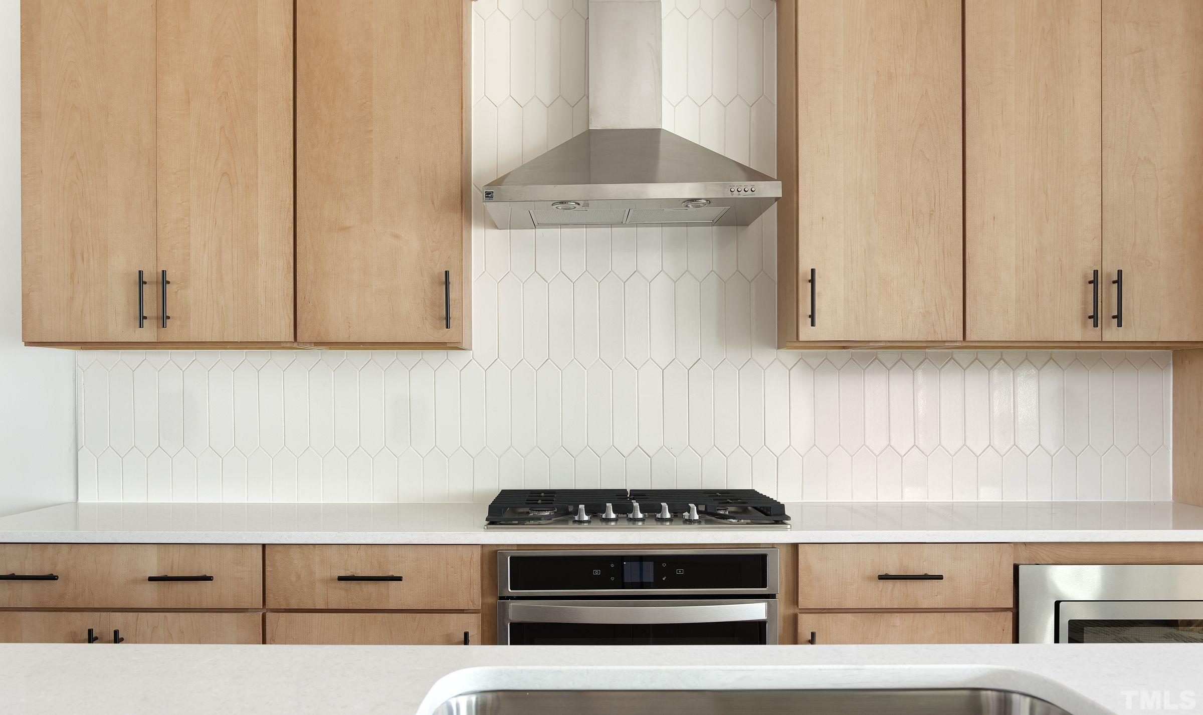 515 Bistre Drive, Unit 245 Cary, NC 27519 - Photo 3 of 16 a stove top oven sitting inside of a kitchen