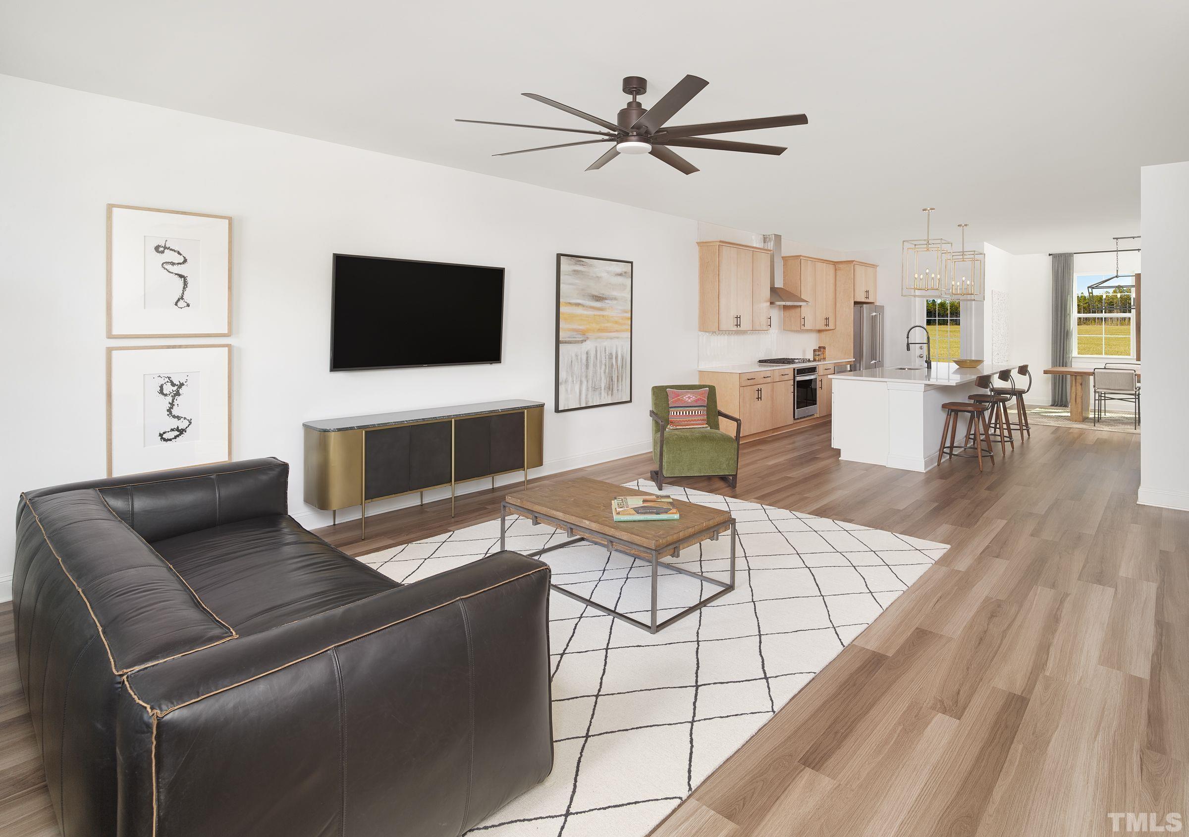 515 Bistre Drive, Unit 245 Cary, NC 27519 - Photo 4 of 16 a living room with furniture a flat screen tv and a fireplace