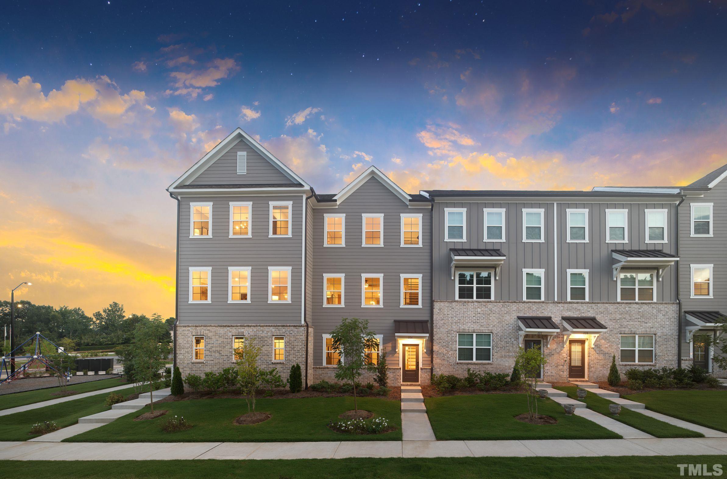 515 Bistre Drive, Unit 245 Cary, NC 27519 - Photo 9 of 16 a front view of a residential apartment building with a yard