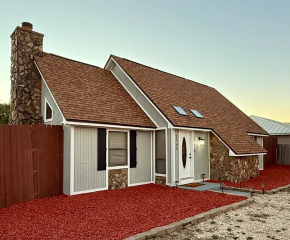 a front view of a house with a porch