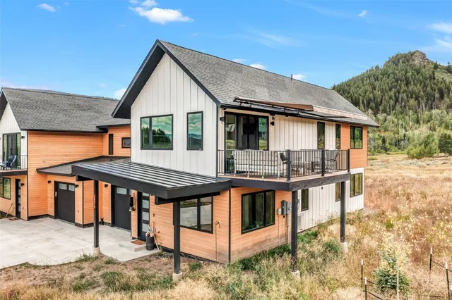 a view of a house with wooden floor roof and furniture