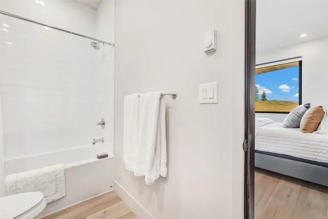 a bathroom with a tub and shower