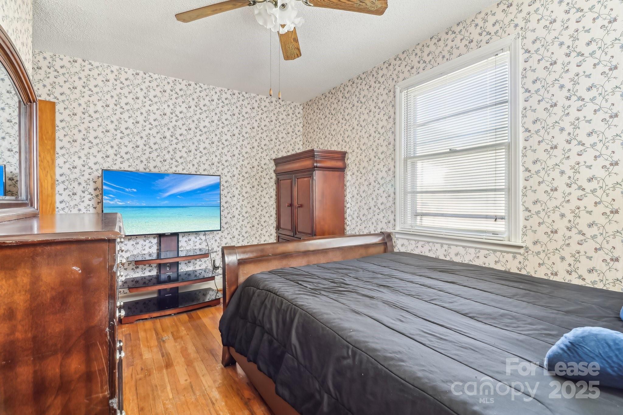 3422 Covenant Road Columbia, SC 29204 - Photo 17 of 27 a bedroom with a bed and a window with wooden floor