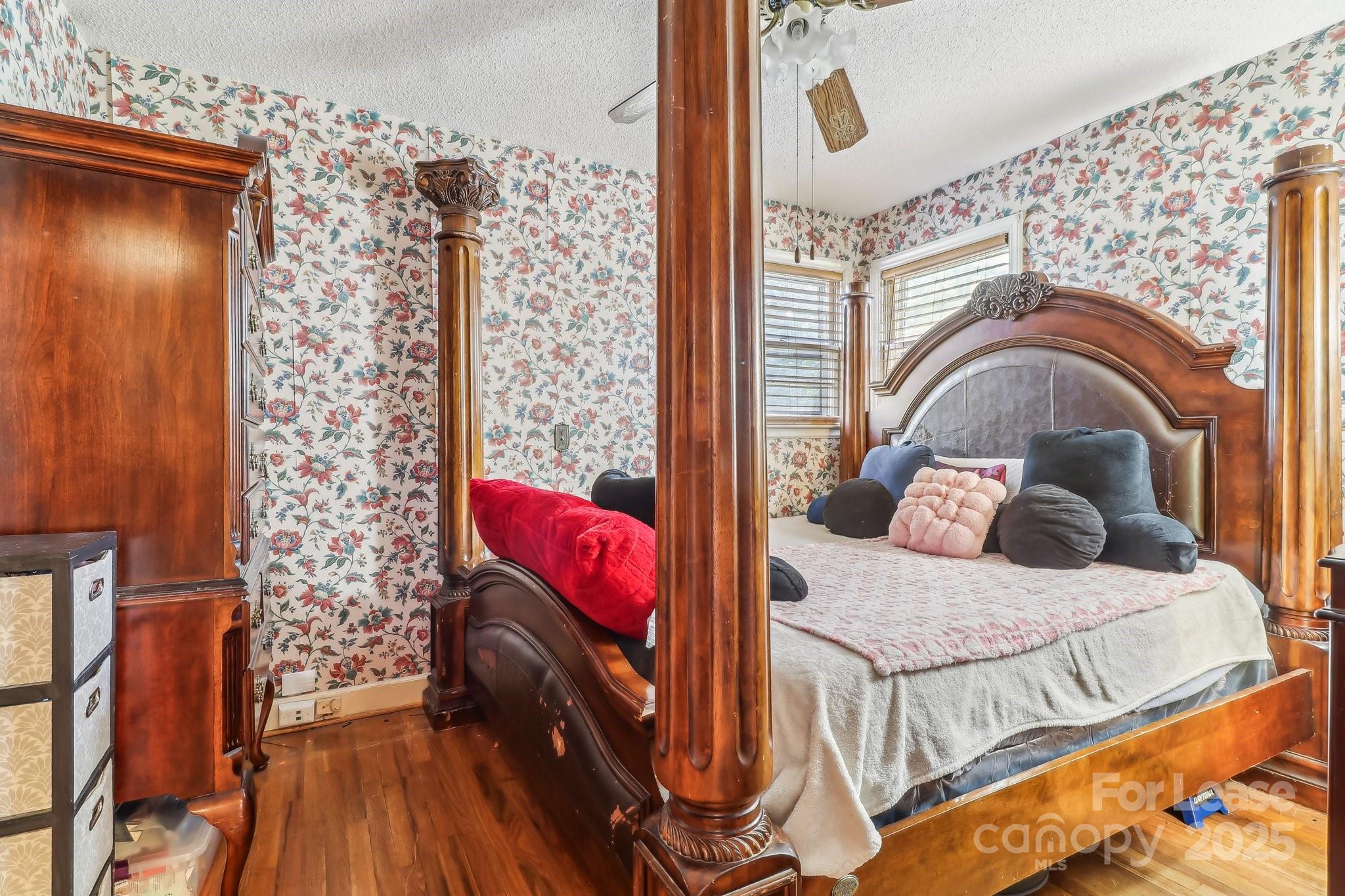 3422 Covenant Road Columbia, SC 29204 - Photo 18 of 27 a bedroom with a bed and wooden floor
