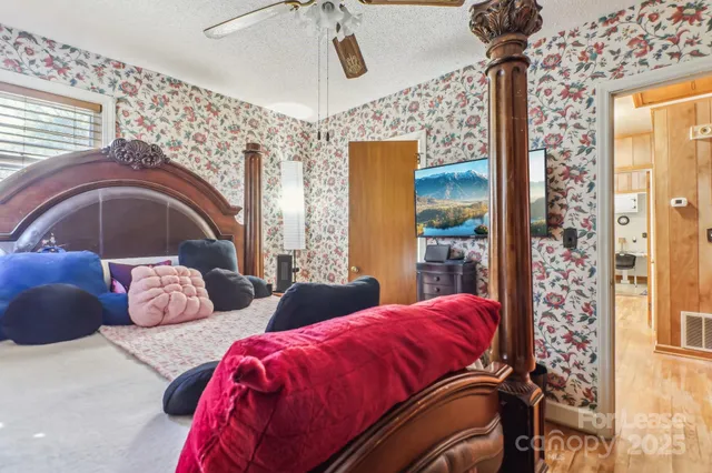 a bedroom with bed and a window