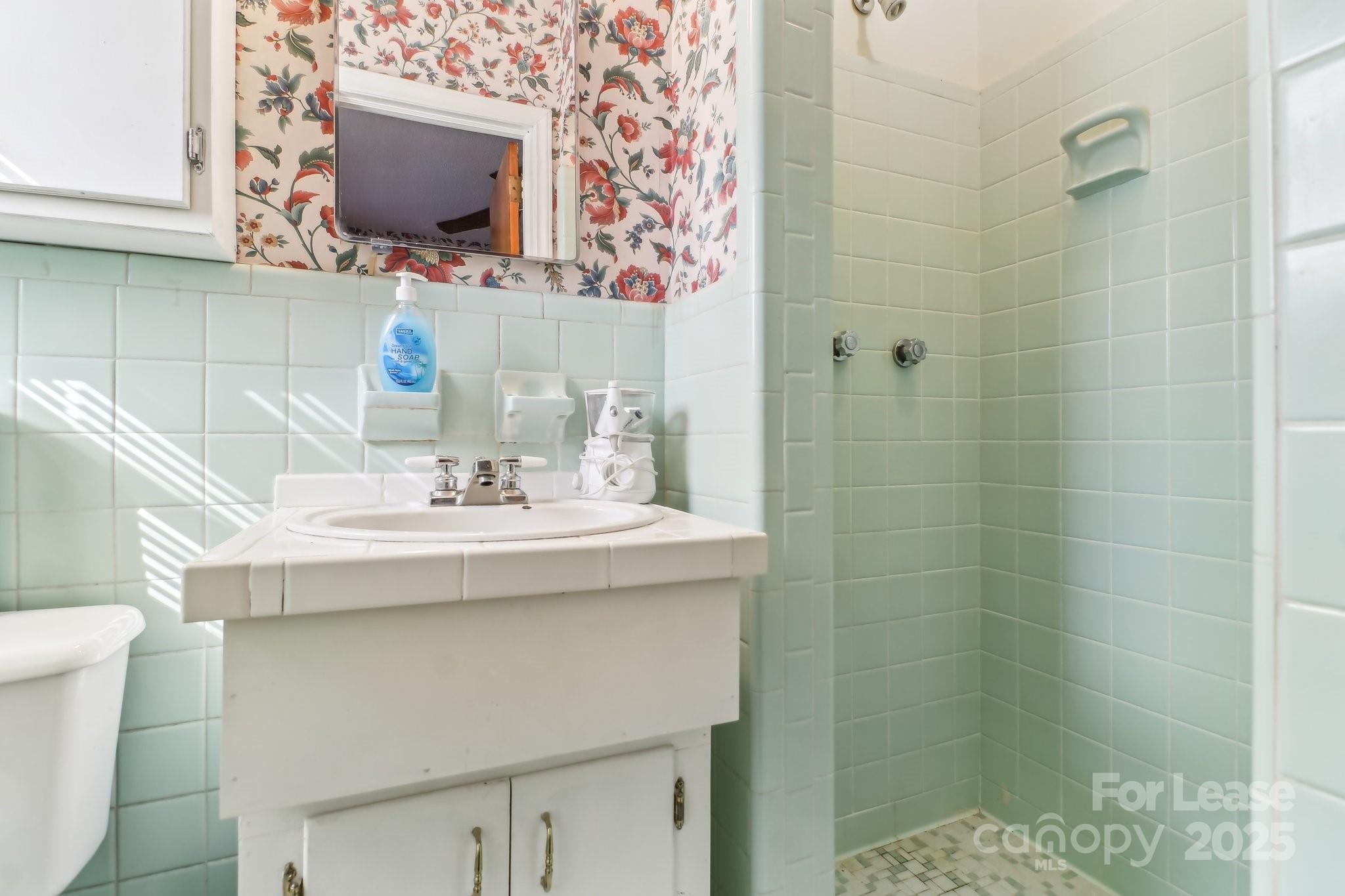 3422 Covenant Road Columbia, SC 29204 - Photo 21 of 27 a bathroom with a sink toilet and shower