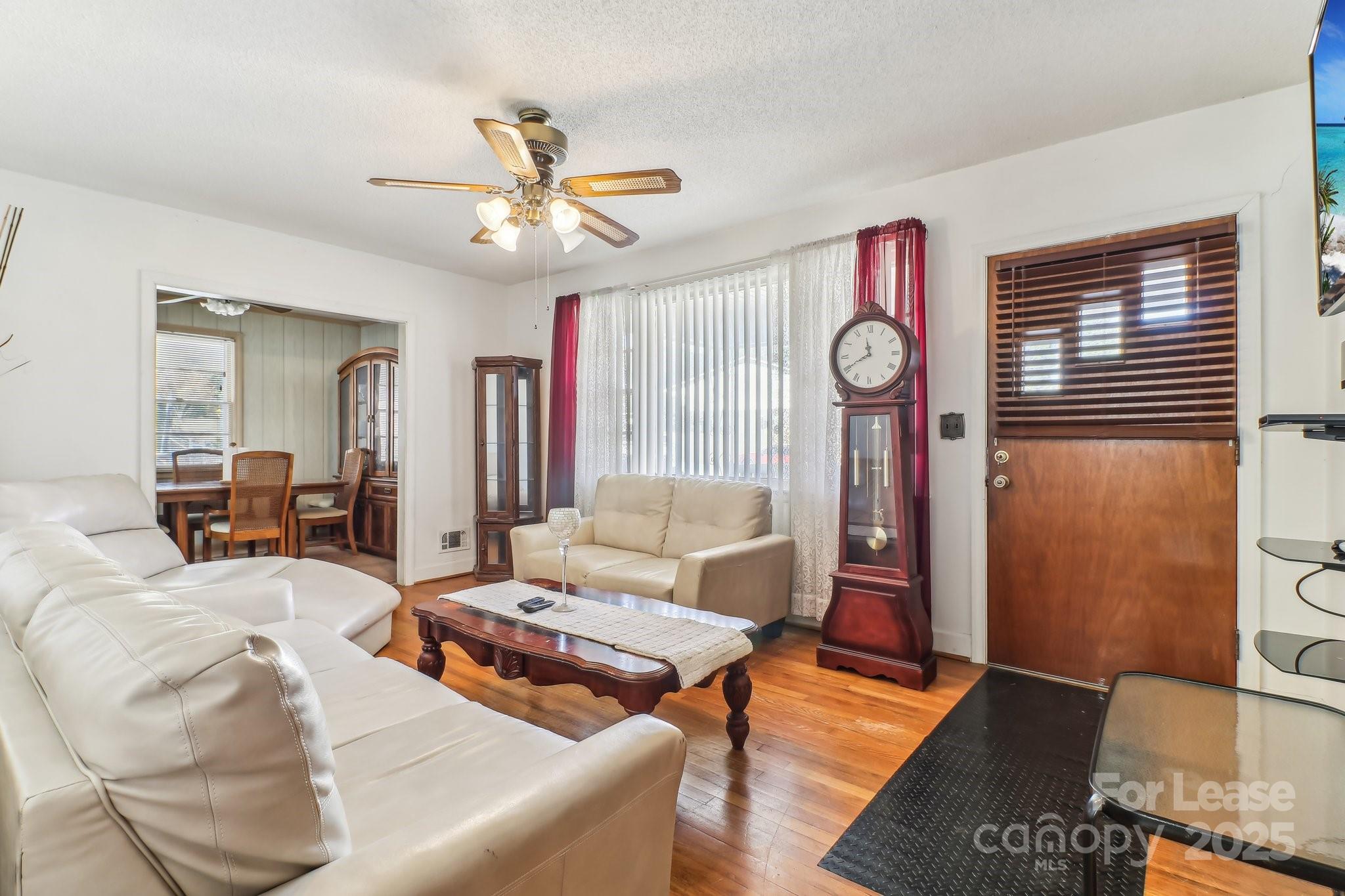 3422 Covenant Road Columbia, SC 29204 - Photo 5 of 27 a living room with furniture a clock and a window