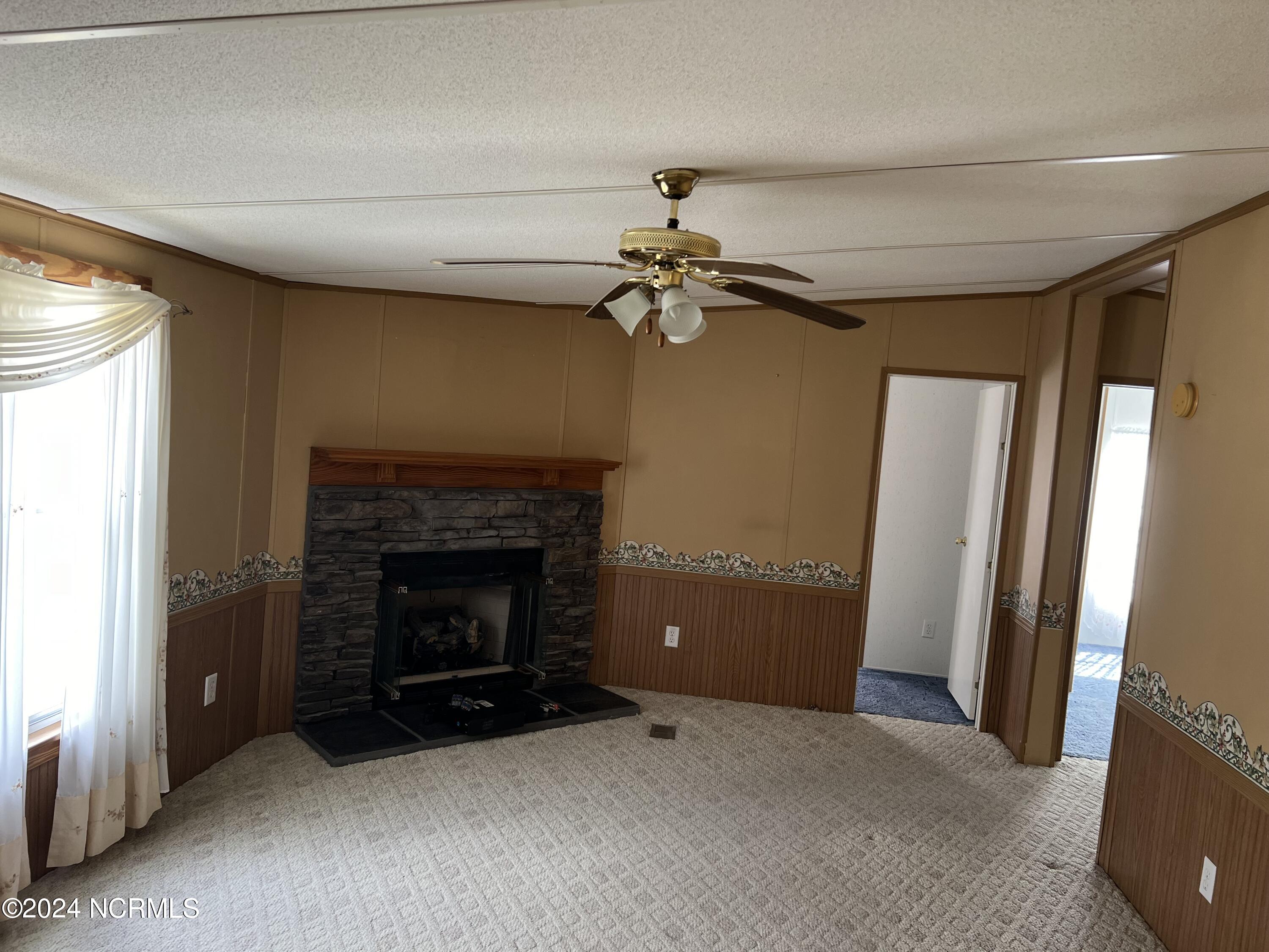 4345 Colonial Road Tarboro, NC 27886 - Photo 13 of 32 Den with Gas logs