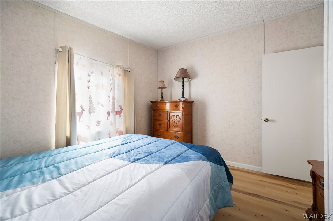 2465 Egar Road Golden Valley, AZ 86413 - Photo 34 of 98 This room features light-colored walls, a window with curtains, and a white interior door