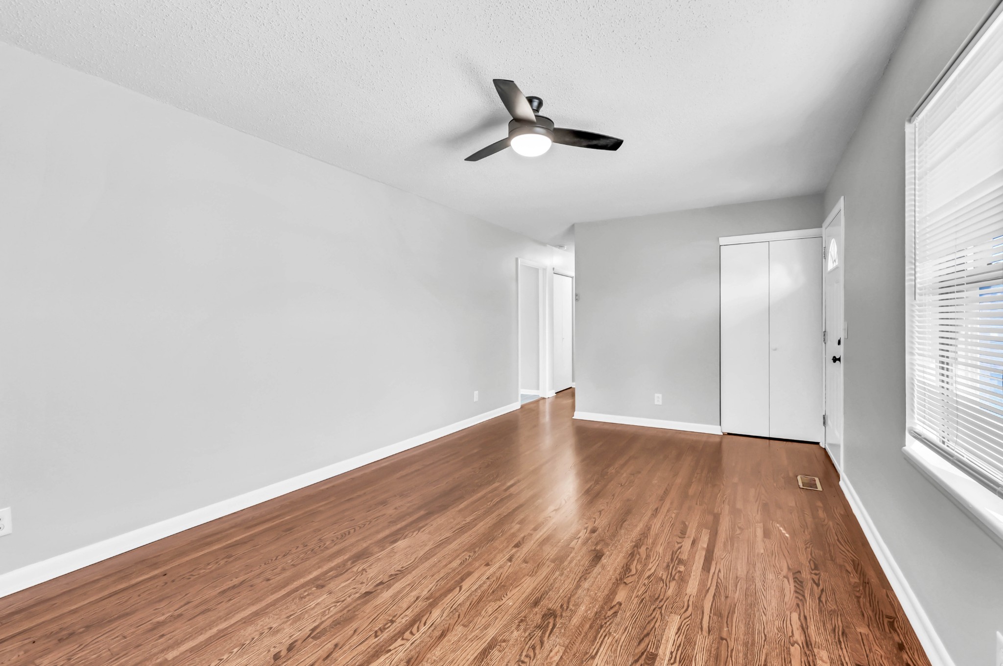 805 East 8th Avenue Springfield, TN 37172 - Photo 4 of 16 wooden floor in an empty room with a window