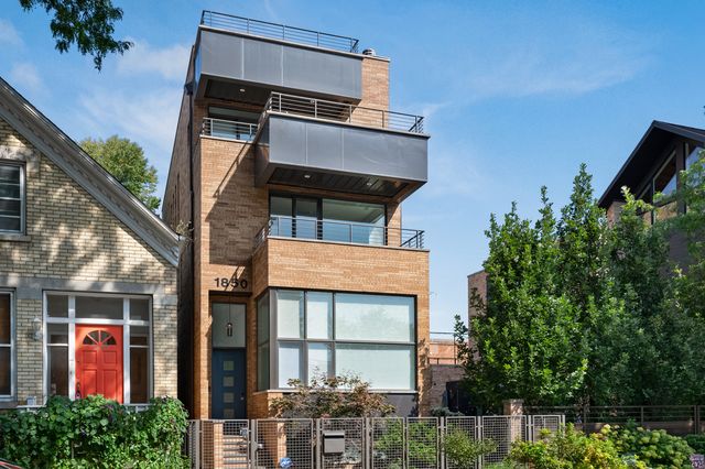 a view of a building with a tree