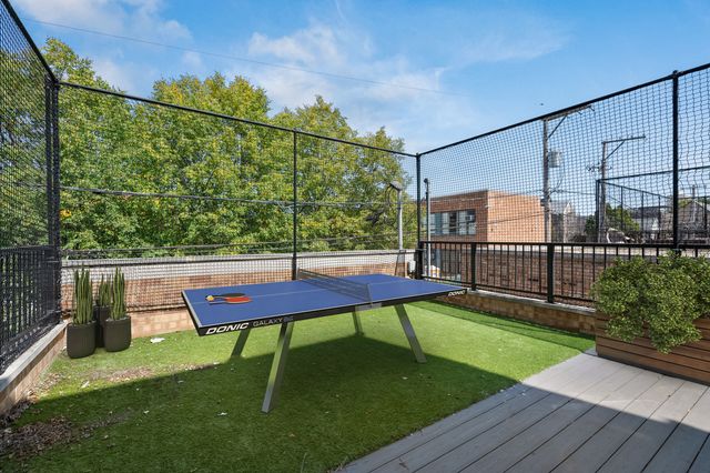 a view of a bench in the backyard