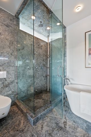 a bathroom with a shower and a bathtub