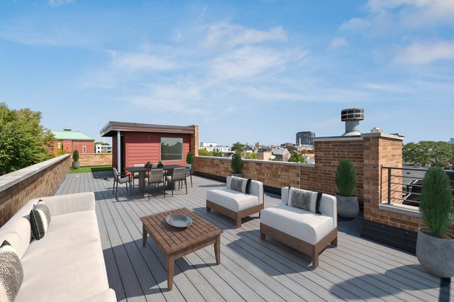 a view of a roof deck with couches