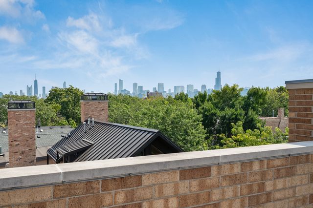 a view of a building from the roof deck