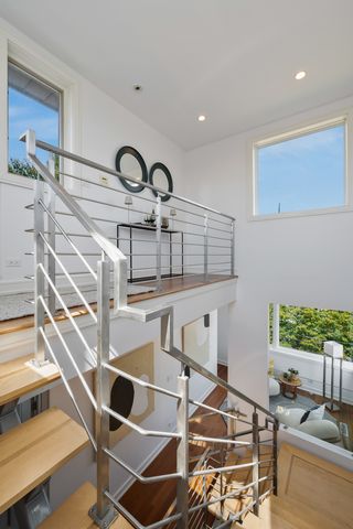 a view of a kitchen with a dining table and chairs