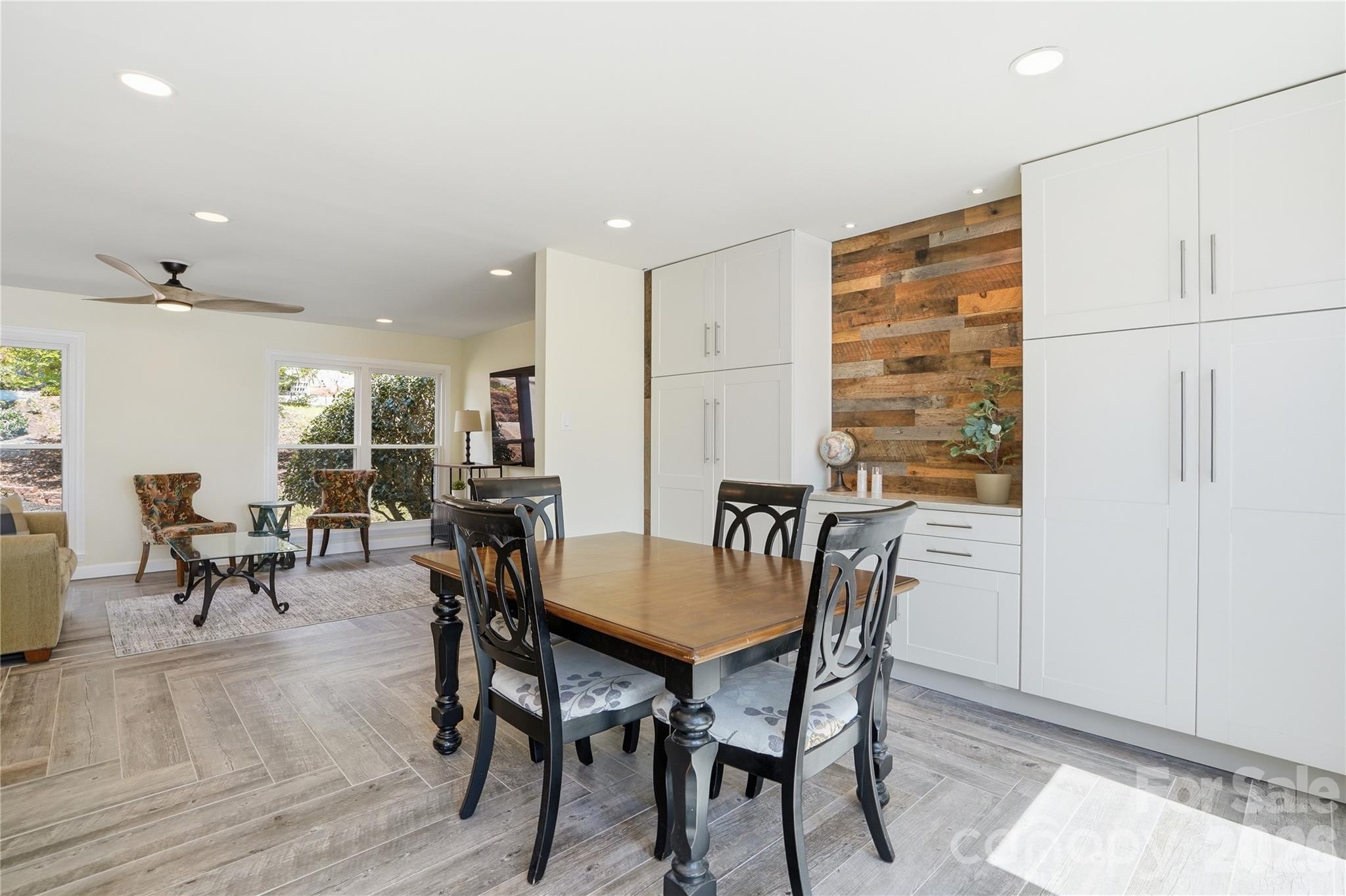 19011 Kailua Circle Tega Cay, SC 29708 - Photo 12 of 48 a view of a dining room with furniture and a potted plant