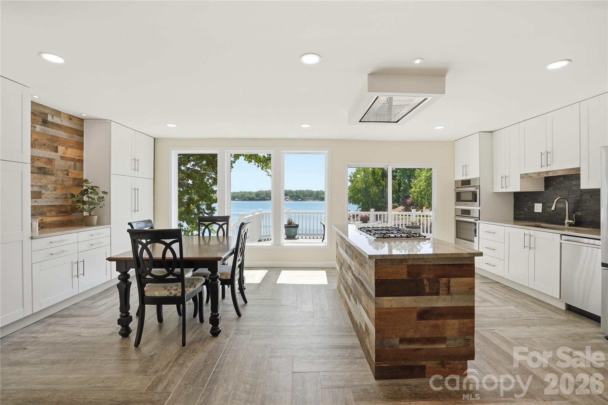 19011 Kailua Circle Tega Cay, SC 29708 - Photo 13 of 48 a view of a dining room with furniture window and wooden floor