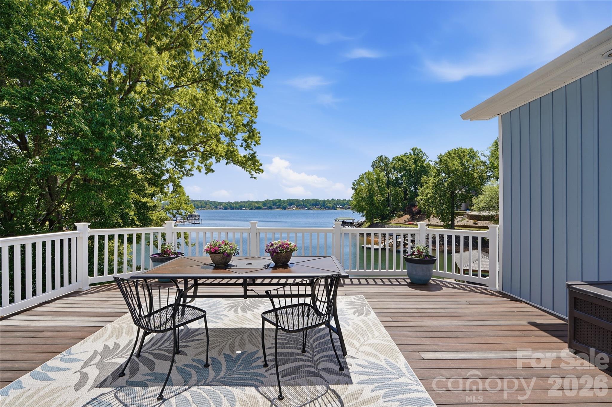 19011 Kailua Circle Tega Cay, SC 29708 - Photo 15 of 48 a view of a table and chairs on the roof deck
