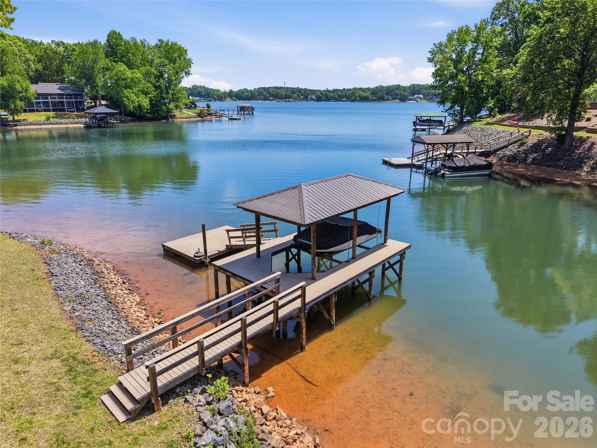 19011 Kailua Circle Tega Cay, SC 29708 - Photo 18 of 48 a view of a lake with couches chairs