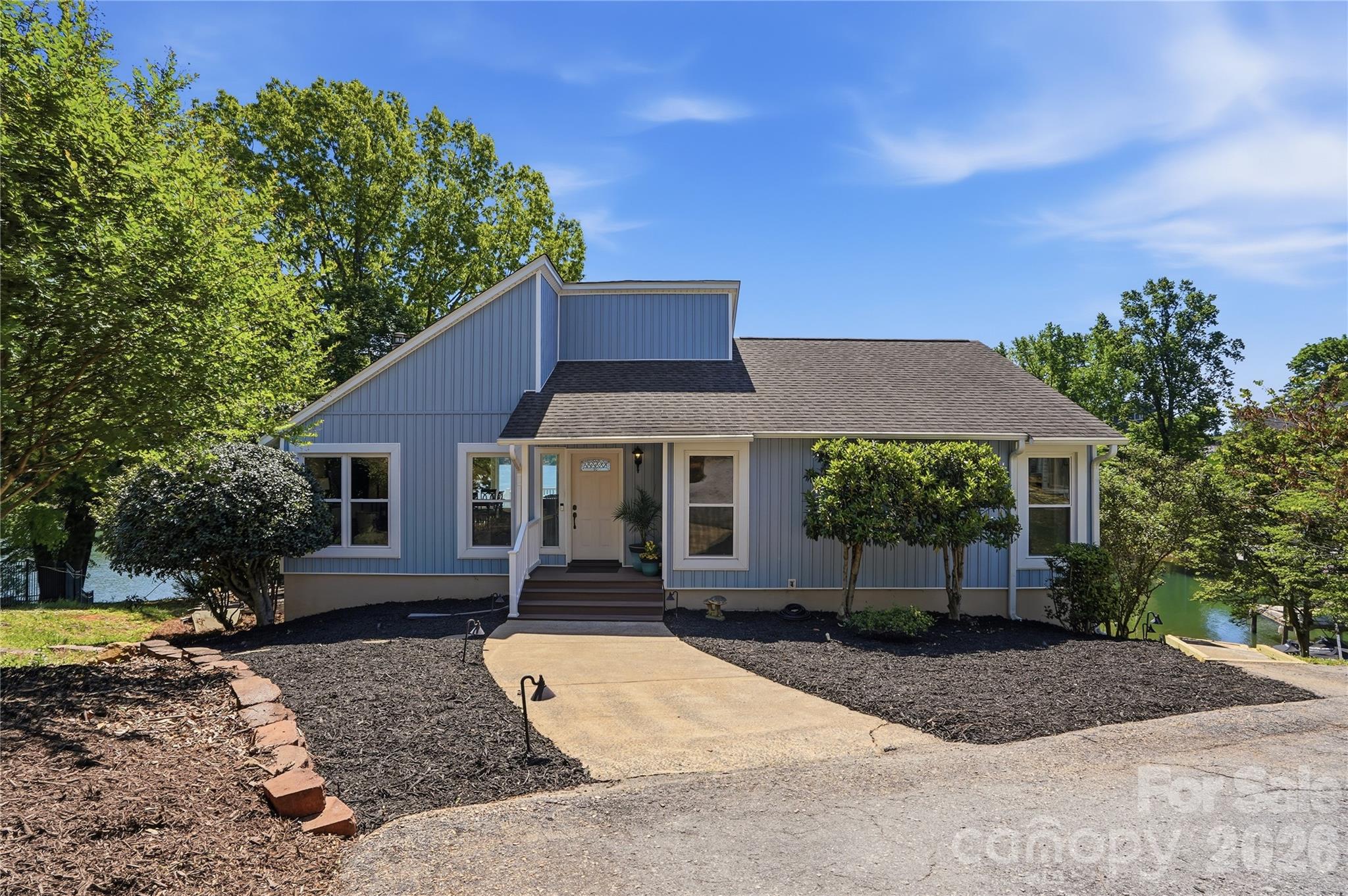 19011 Kailua Circle Tega Cay, SC 29708 - Photo 2 of 48 a front view of a house with a yard and trees