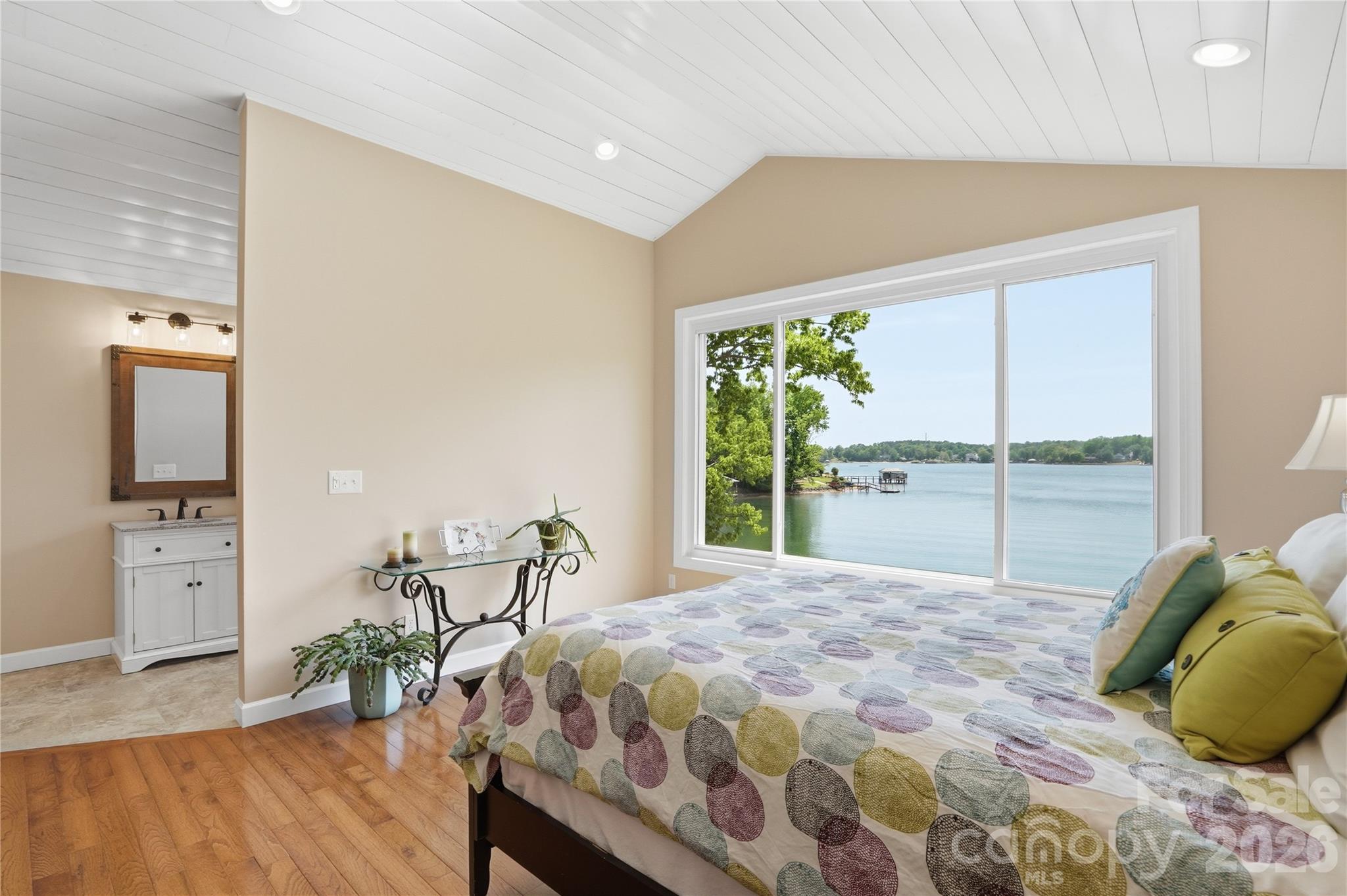 19011 Kailua Circle Tega Cay, SC 29708 - Photo 23 of 48 a bedroom with a bed and large windows