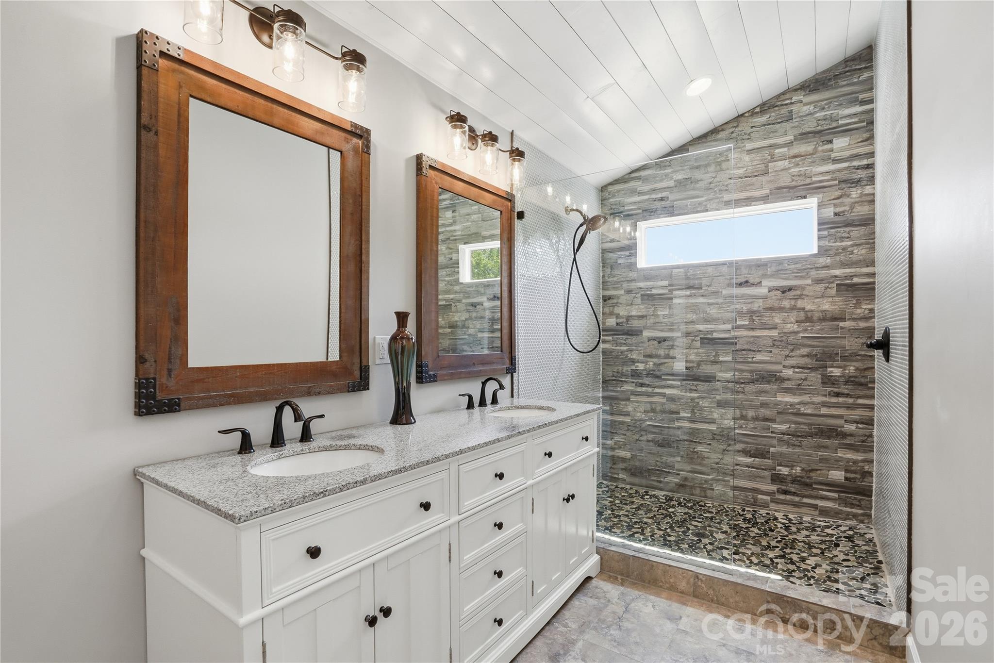 19011 Kailua Circle Tega Cay, SC 29708 - Photo 24 of 48 a bathroom with a sink vanity granite and a mirror